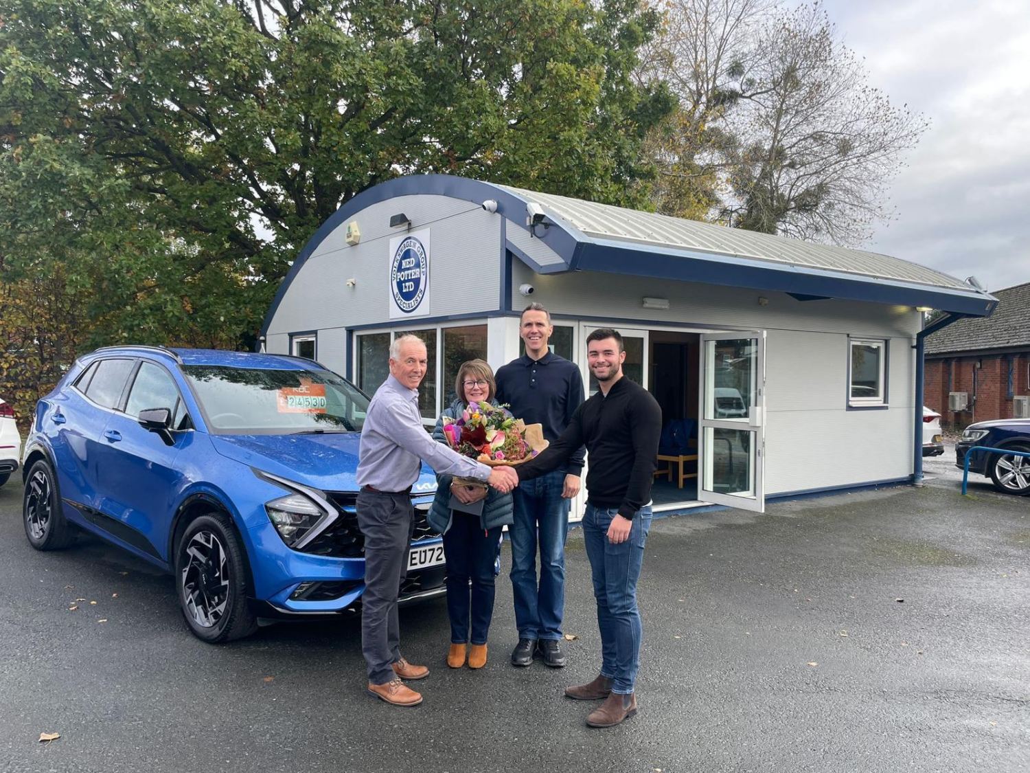 A happy customer collects their new car from the Ned Potter team in Hereford